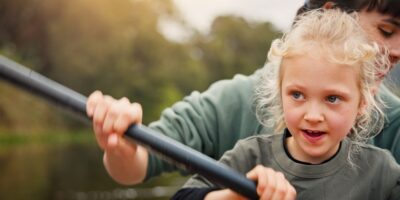 A mum and child kayaking.