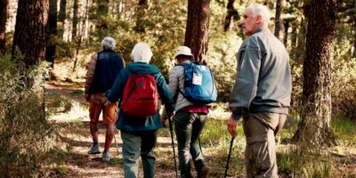 Group of older adults hiking in the forest