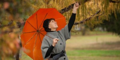 A woman under an umbrella.